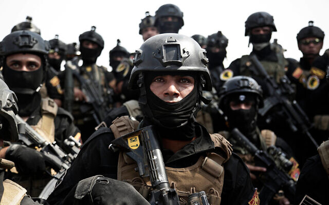 Iraqi forces raid Iran-backed militia base in Baghdad, arrest dozens