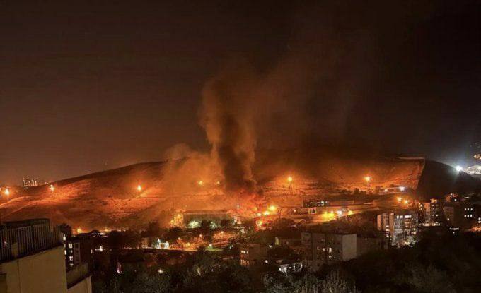 Gunfire heard as huge blaze breaks out at Iran’s notorious jail amid protests