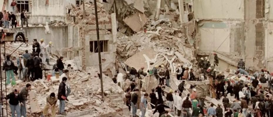 Rescue workers search the remains of the AMIA headquarters in Buenos Aires, Argentina, in 1994.